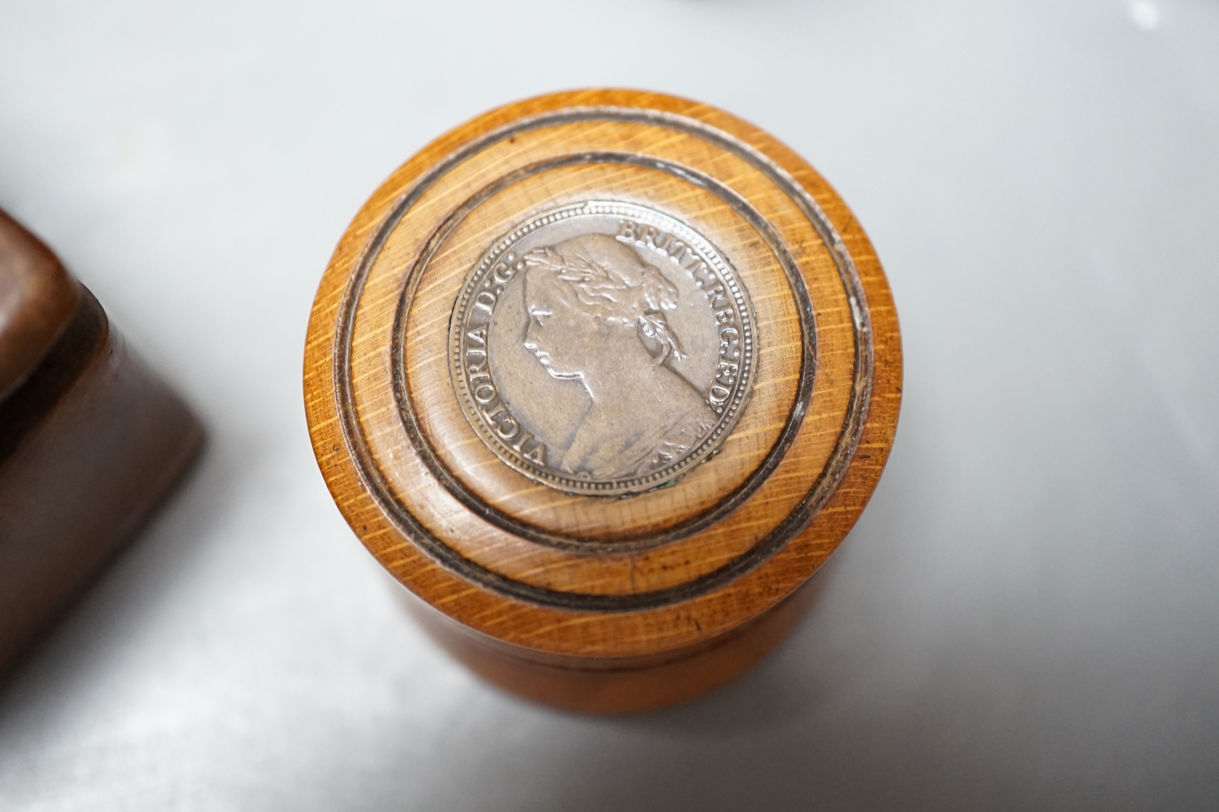 19th Century treen – a fruitwood rectangular dish, 17.5cm, inscribed HTGF 1843 a fruit wood box and cover and a coin inset box and cover t